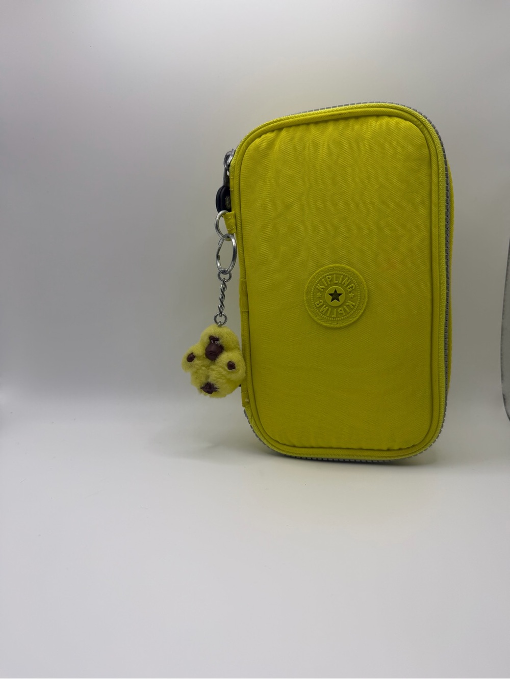 Kipling Neon Yellow Zip Phone Pouch with Plush Charm